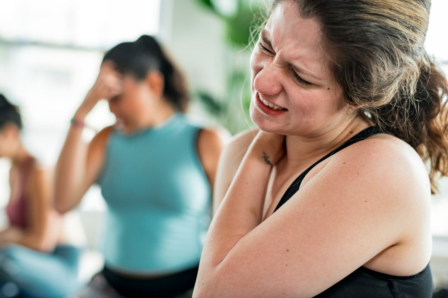 Woman having a shoulder pain